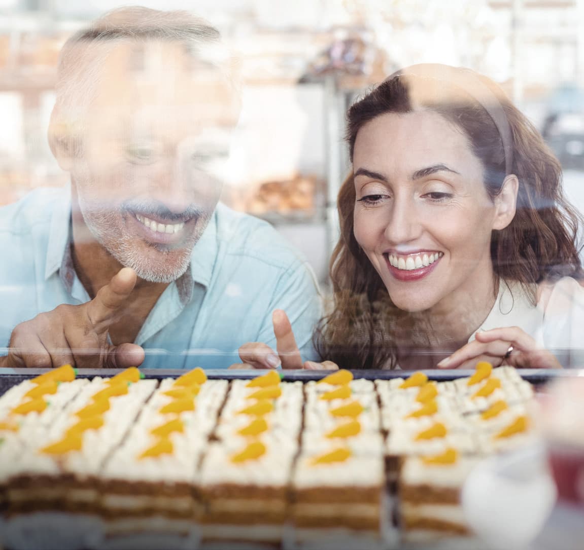Couple looking through a downtown Milton storefront window
